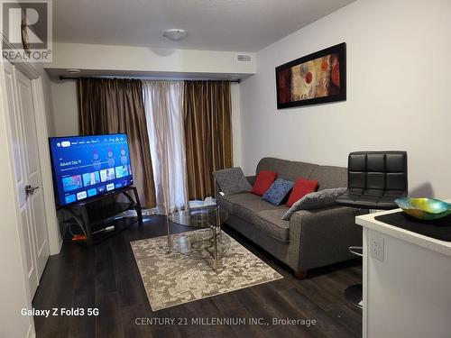 100 - 6705 Cropp Street, Niagara Falls, ON - Indoor Photo Showing Living Room