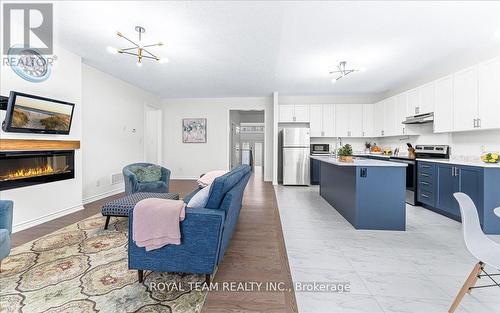 154 Ramblewood Drive, Wasaga Beach, ON - Indoor Photo Showing Kitchen With Fireplace