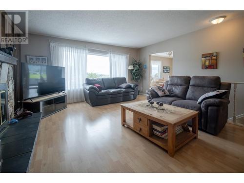 3912 17 Avenue, Vernon, BC - Indoor Photo Showing Living Room With Fireplace