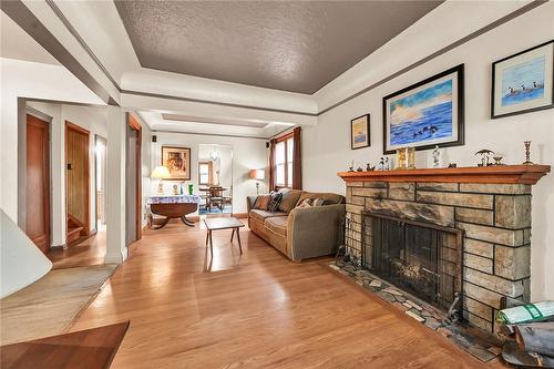 53 Queensdale Avenue E, Hamilton, ON - Indoor Photo Showing Living Room With Fireplace