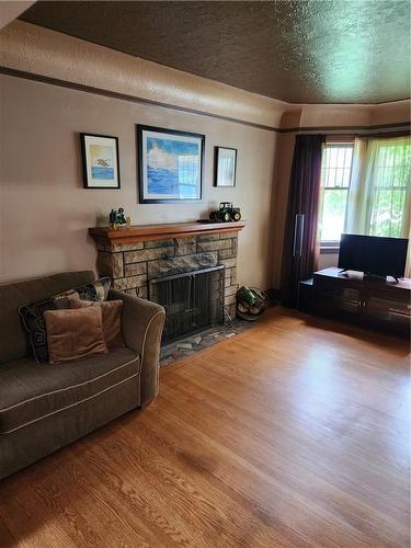 53 Queensdale Avenue E, Hamilton, ON - Indoor With Fireplace