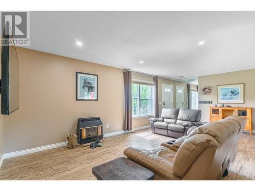 94 Tomkinson Road, Grindrod, BC - Indoor Photo Showing Living Room With Fireplace