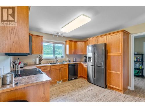 94 Tomkinson Road, Grindrod, BC - Indoor Photo Showing Kitchen With Double Sink