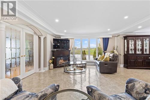 1819 Baseline Road, Clarence-Rockland, ON - Indoor Photo Showing Living Room With Fireplace