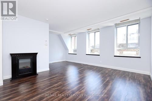 504 - 135 Maitland Street, Toronto, ON - Indoor Photo Showing Living Room With Fireplace