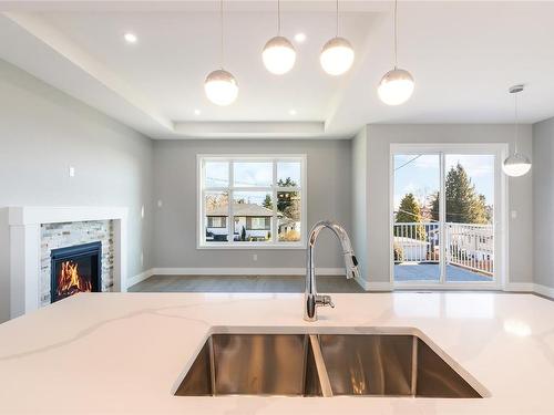 57 Acacia Ave, Nanaimo, BC - Indoor Photo Showing Kitchen With Fireplace With Double Sink