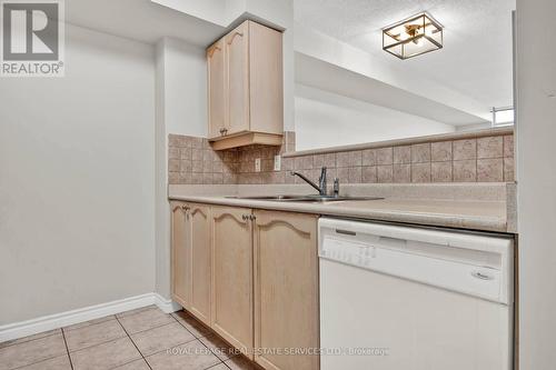 303 - 710 Humberwood Boulevard W, Toronto, ON - Indoor Photo Showing Kitchen With Double Sink