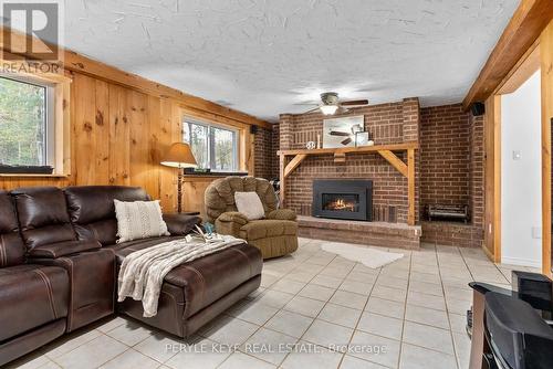 98 Clearwater Lake Road, Huntsville, ON - Indoor Photo Showing Living Room With Fireplace