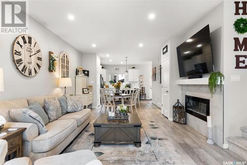3221 Valley Green Road, Regina, SK - Indoor Photo Showing Living Room With Fireplace
