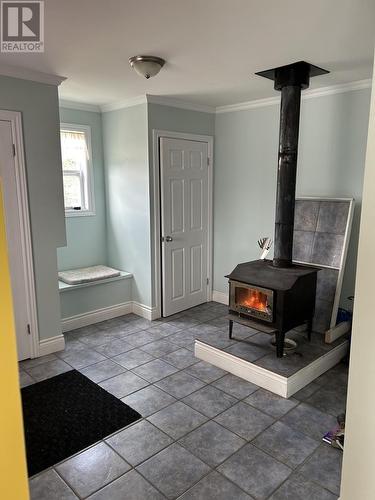83 Main Street, Deadman'S Bay, NL - Indoor Photo Showing Other Room With Fireplace