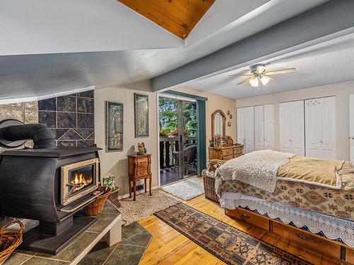2735 Virginia Dr, Courtenay, BC - Indoor Photo Showing Bedroom With Fireplace