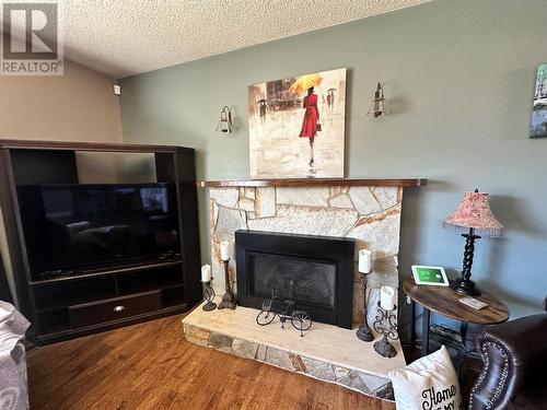 9412 9 Street, Dawson Creek, BC - Indoor Photo Showing Living Room With Fireplace
