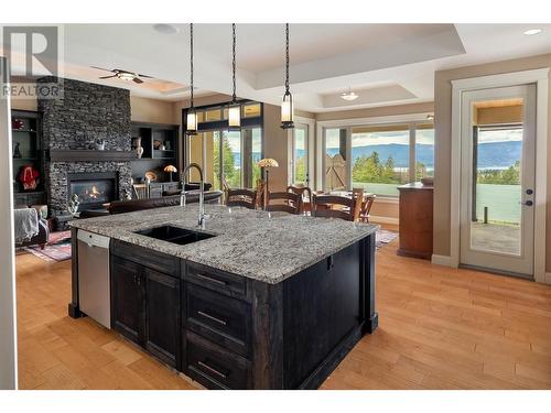 4531 Gaspardone Road, Kelowna, BC - Indoor Photo Showing Kitchen With Fireplace With Double Sink