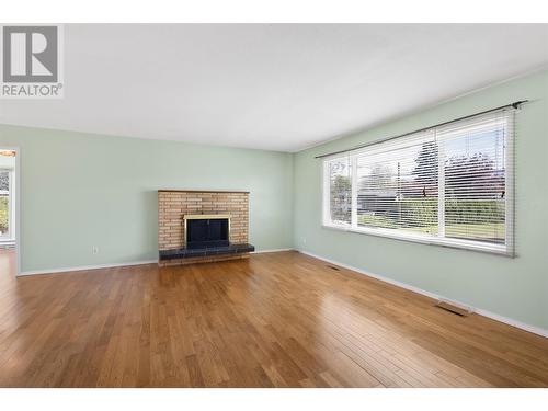 2040 Polo Road, Kelowna, BC - Indoor Photo Showing Living Room With Fireplace