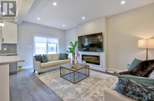 6429 Royal Magnolia Avenue, London, ON - Indoor Photo Showing Living Room With Fireplace