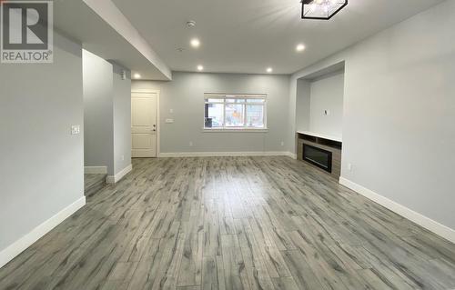 722 Coopland Crescent Unit# 1-4, Kelowna, BC - Indoor Photo Showing Other Room With Fireplace