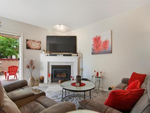 101-2388 Baron Road, Kelowna, BC - Indoor Photo Showing Living Room With Fireplace