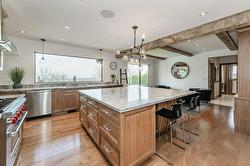 A vast center island in this new kitchen with seating for 6 - 