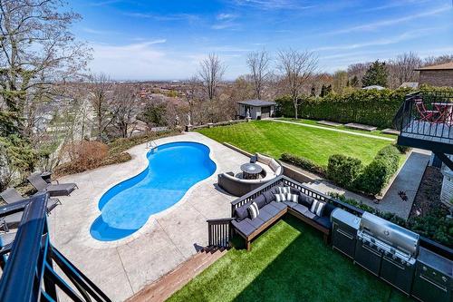 Over looking the pool from the balcony off the Primary Bedroom - 31 Hilts Drive, Hamilton, ON - Outdoor With In Ground Pool With Backyard