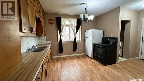 1250 Elliott Street, Regina, SK - Indoor Photo Showing Kitchen With Double Sink