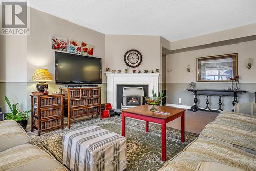 114 - 245 Elgin Street, Cobourg, ON - Indoor Photo Showing Living Room With Fireplace
