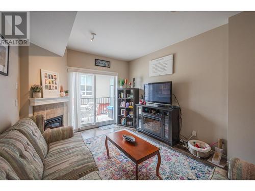 3363 Wilson Street Unit# 126, Penticton, BC - Indoor Photo Showing Living Room With Fireplace