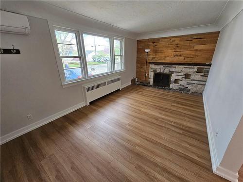 638 Rosseau Road|Unit #Main Flr, Hamilton, ON - Indoor Photo Showing Living Room With Fireplace