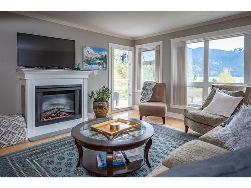305 - 550 Rainbow Drive, Kaslo, BC - Indoor Photo Showing Living Room With Fireplace