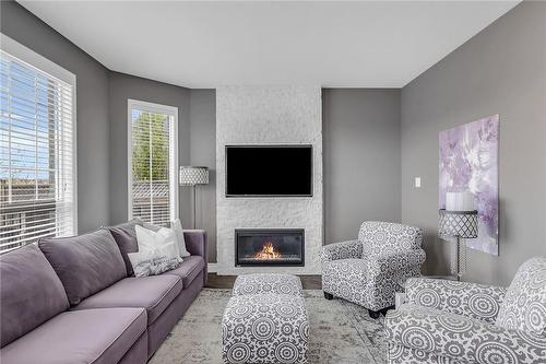 910 Cousens Terrace, Milton, ON - Indoor Photo Showing Living Room With Fireplace
