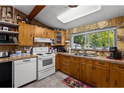 7553 Stampede Trail, Anglemont, BC - Indoor Photo Showing Kitchen With Double Sink