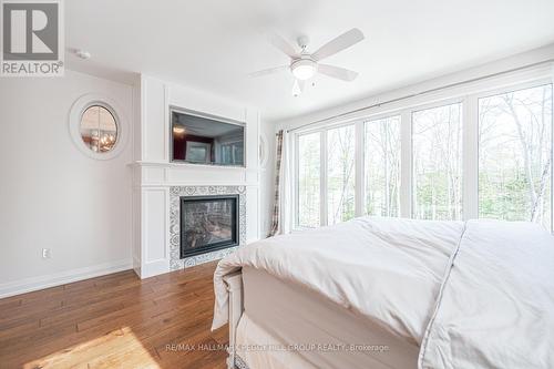 3691 Brunel Road, Huntsville, ON - Indoor Photo Showing Bedroom With Fireplace