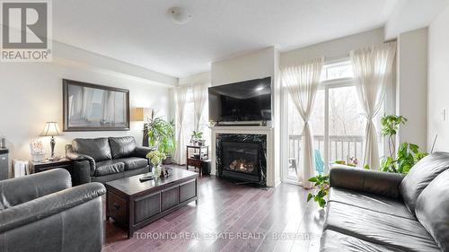 18 - 3350 Thomas Street, Mississauga, ON - Indoor Photo Showing Living Room With Fireplace