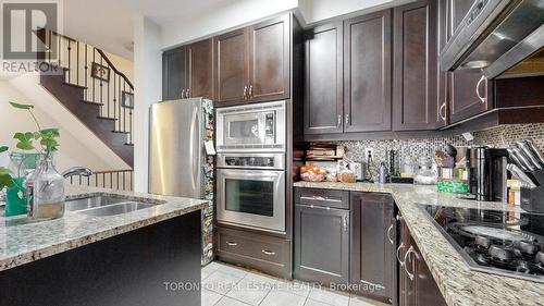 18 - 3350 Thomas Street, Mississauga, ON - Indoor Photo Showing Kitchen With Stainless Steel Kitchen With Double Sink With Upgraded Kitchen