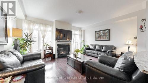 18 - 3350 Thomas Street, Mississauga, ON - Indoor Photo Showing Living Room With Fireplace