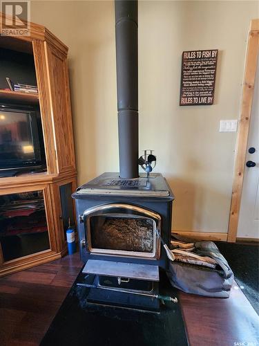 159 Grenfell Beach, Crooked Lake, SK - Indoor With Fireplace