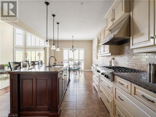 Take part in the prep of your favorite meal around the island with your significant other and enjoy the space and functionality of this well laid out Kitchen. - 110 Golf Course Road, Woolwich, ON - Indoor Photo Showing Kitchen With Upgraded Kitchen