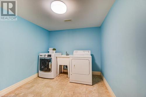 There are loads of storage areas including under the stairs and the laundry room is large enough to encompass all your laundry needs. - 110 Golf Course Road, Woolwich, ON - Indoor Photo Showing Laundry Room