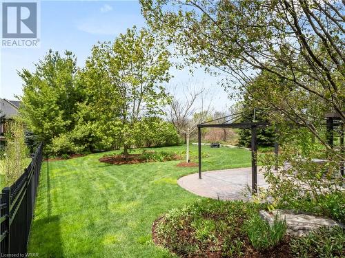 The backyard is fully fenced with wrought iron fencing, so not to impede your view. - 110 Golf Course Road, Woolwich, ON - Outdoor