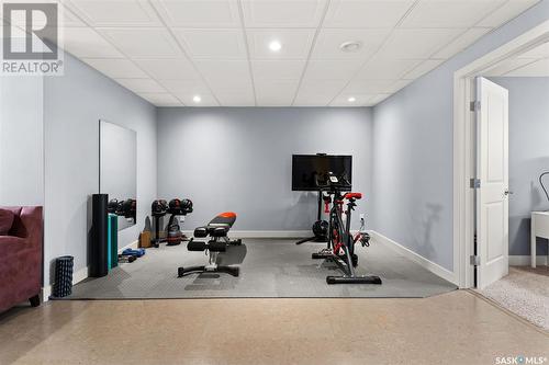 7 New Bay, Emerald Park, SK - Indoor Photo Showing Gym Room