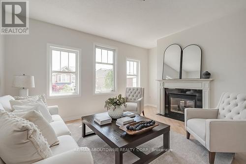 293 Goutouski Crescent, Milton, ON - Indoor Photo Showing Living Room With Fireplace