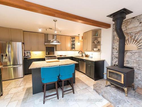 5259 Fourth Line, Guelph/Eramosa, ON - Indoor Photo Showing Kitchen With Fireplace
