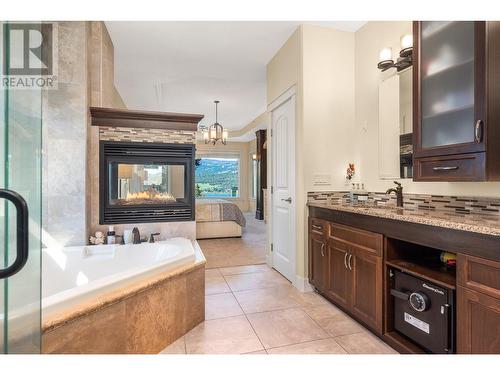 69 Swallows Place, Vernon, BC - Indoor Photo Showing Bathroom With Fireplace