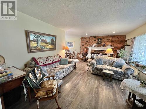 150 S Enemark Road, Quesnel, BC - Indoor Photo Showing Living Room With Fireplace