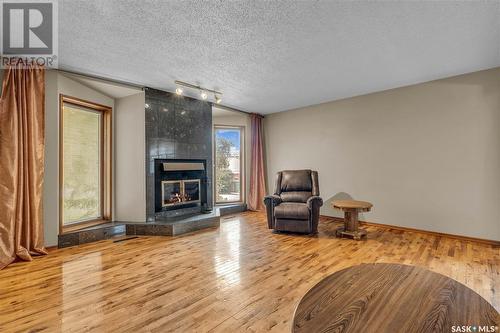 12 Crestview Bay, Regina, SK - Indoor Photo Showing Living Room With Fireplace