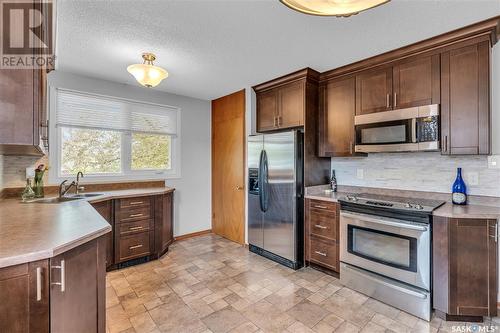 12 Crestview Bay, Regina, SK - Indoor Photo Showing Kitchen With Double Sink