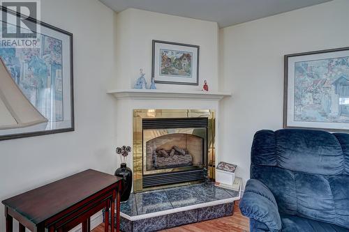 9 Witch Hazel Road, Heart'S Delight, NL - Indoor Photo Showing Living Room With Fireplace
