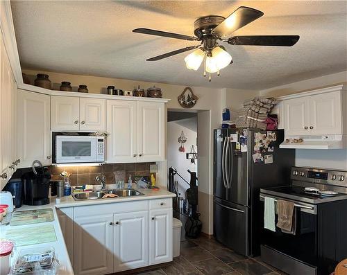 147 Aspen Street, Oak Lake, MB - Indoor Photo Showing Kitchen With Double Sink