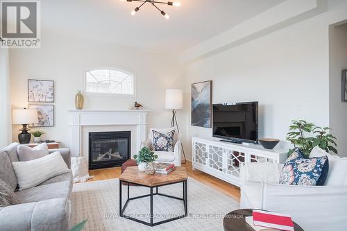 166 Manley Lane, Milton, ON - Indoor Photo Showing Living Room With Fireplace
