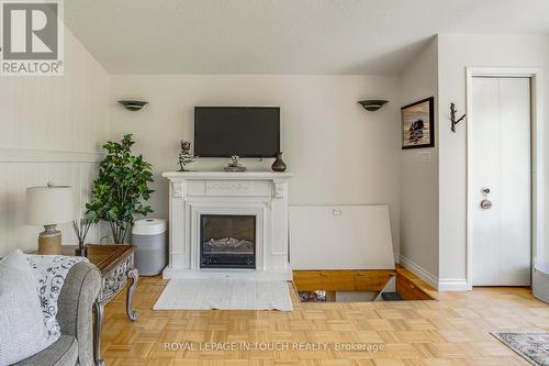 19 Pine Needles Drive, Tiny, ON - Indoor With Fireplace
