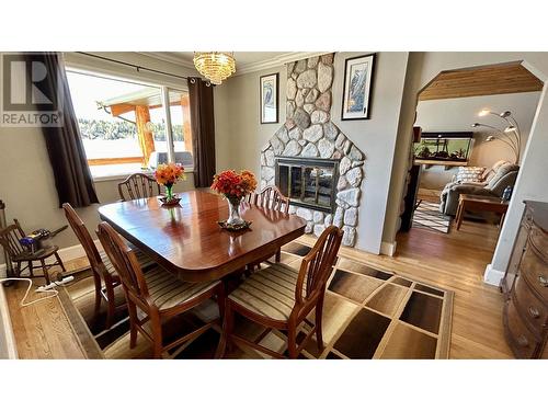 6126 Lakeshore Drive, Horse Lake, BC - Indoor Photo Showing Dining Room With Fireplace